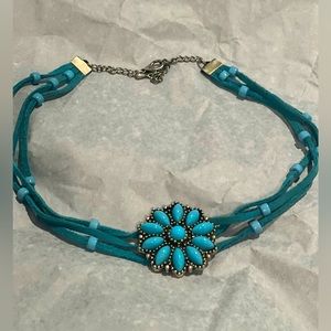 Turquoise neck choker with flower shaped center -never worn